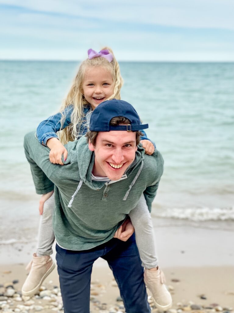 Happy family playing at the beach