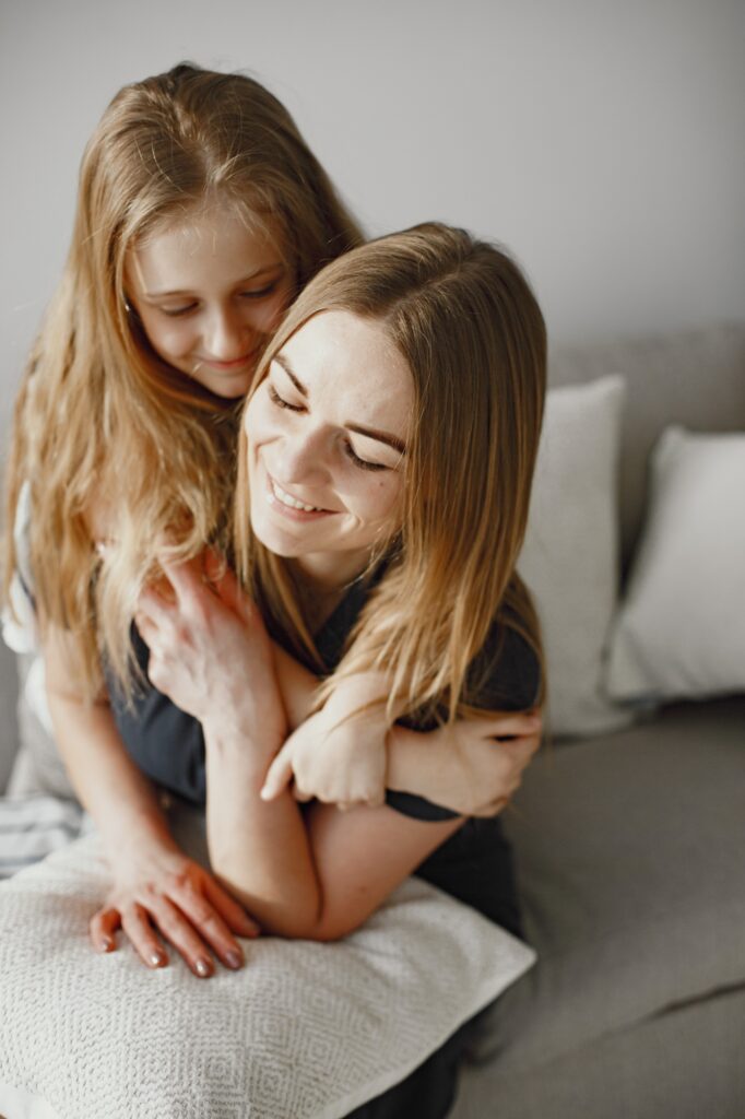 Happy mom and daughter hug and spend time together