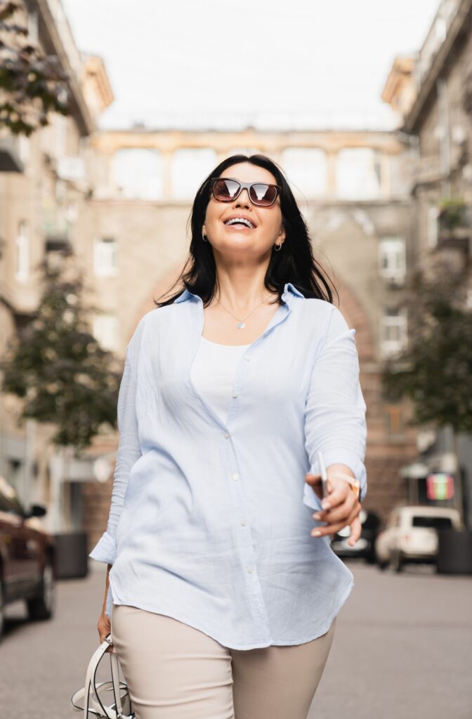 Successful confident mature middle-aged woman wife businesswoman wearing sunglasses
